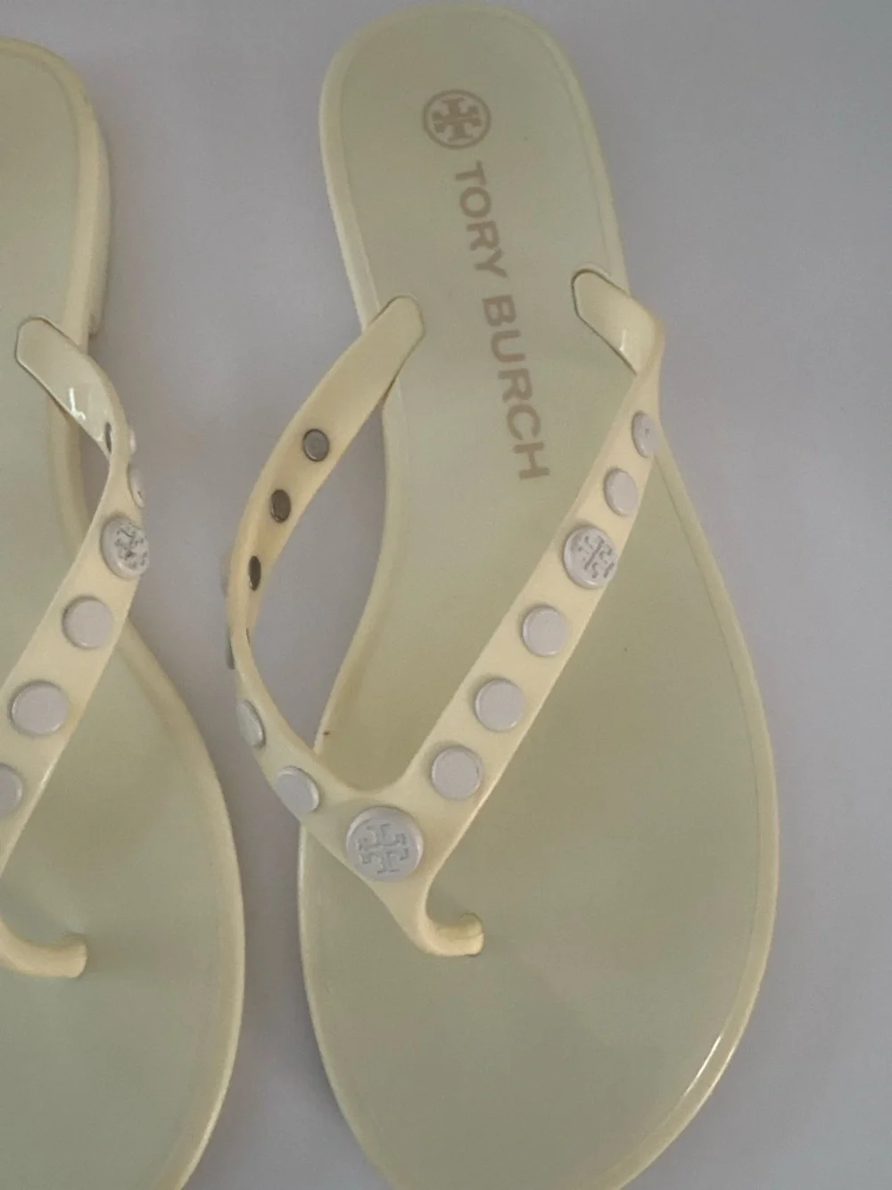 Tory Burch Ivory/pale yellow thong jelly  sandals size 7. Studded w/metal logos